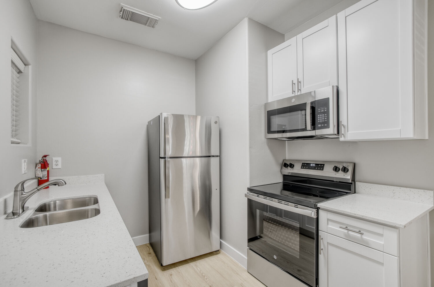 Kitchen with white cabinets and stainless steel appliances