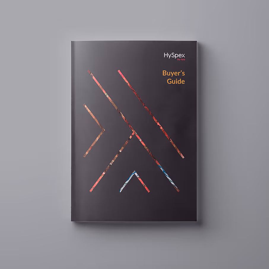 HySpex buyer's guide booklet with a dark cover featuring geometric lines and orange text.