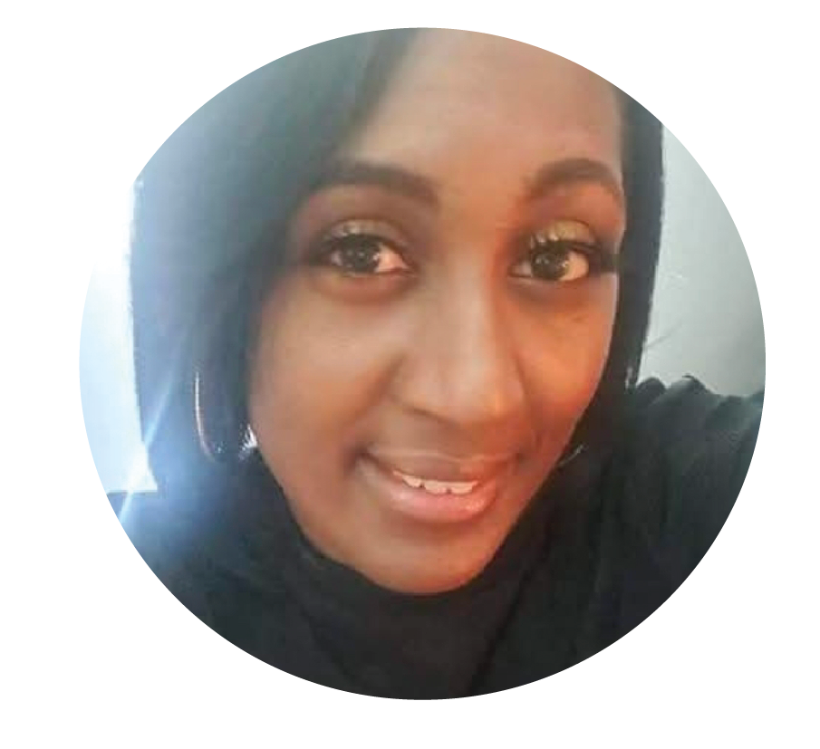 Smiling woman wearing black hijab with warm lighting