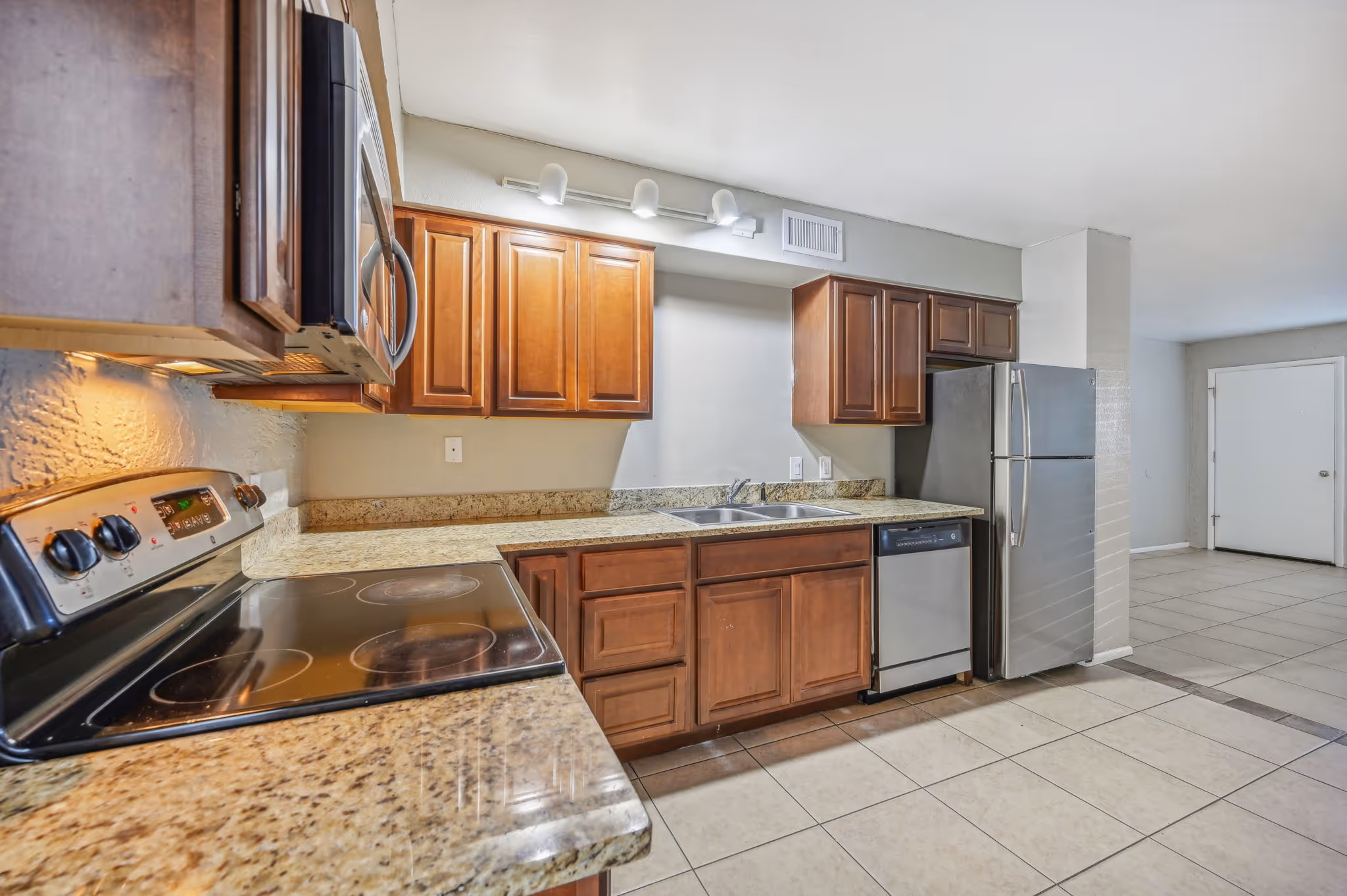 Kitchen with brown cabinets and appliances