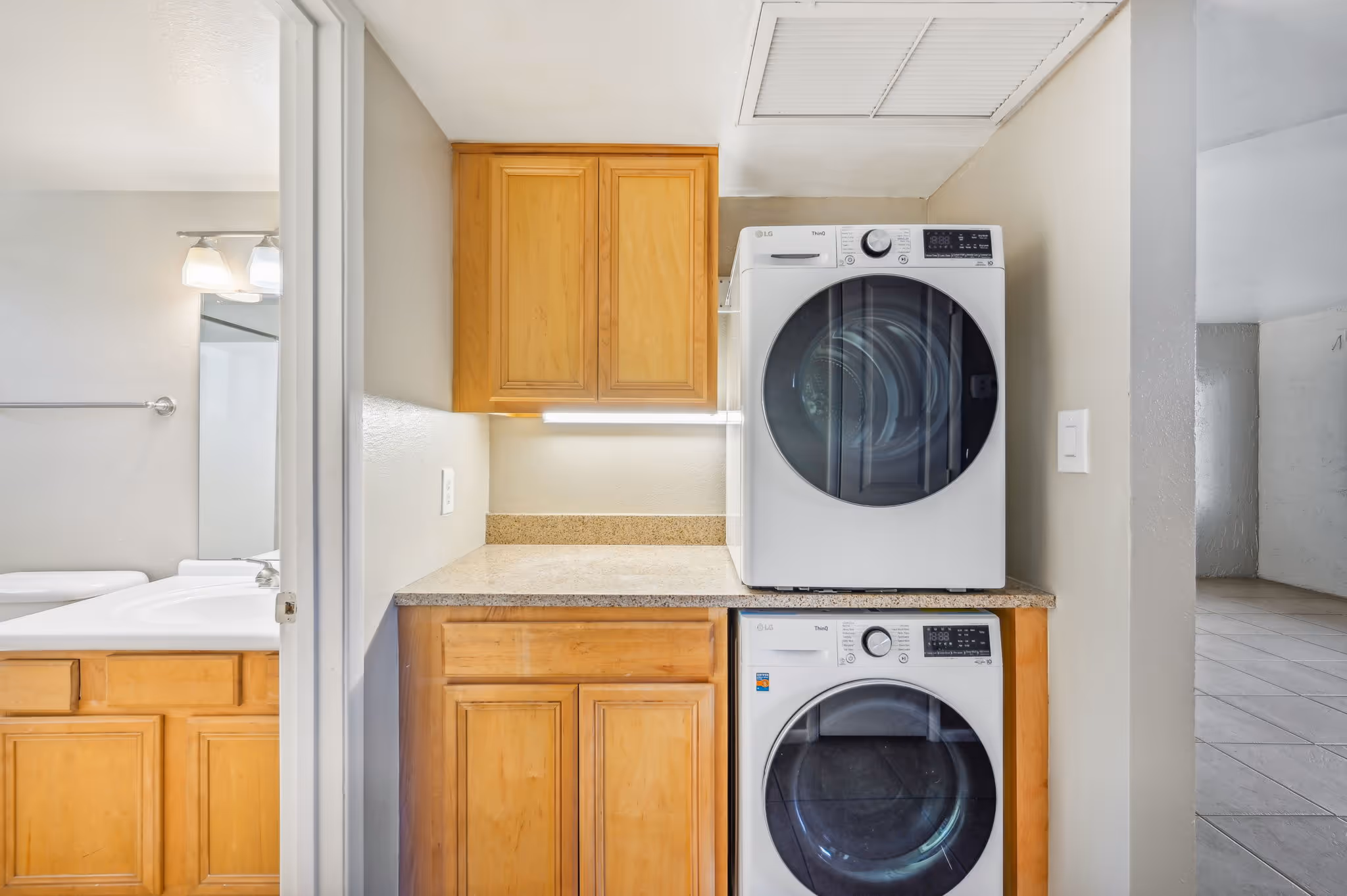 Laundry room with cabinets and washing machine and dryer