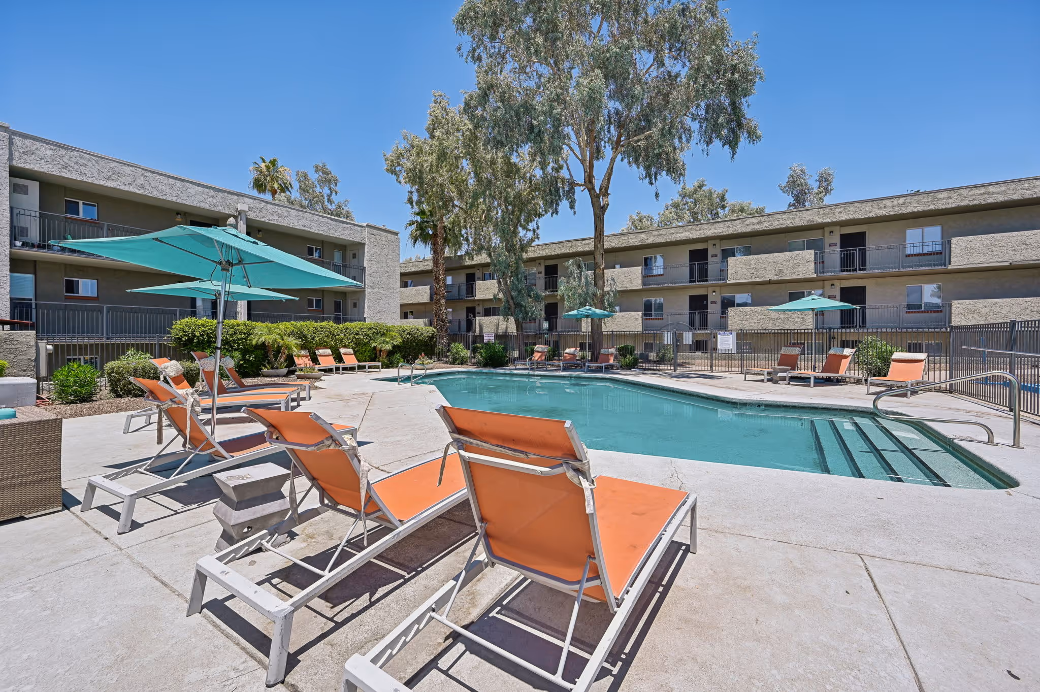 pool with lounge chairs