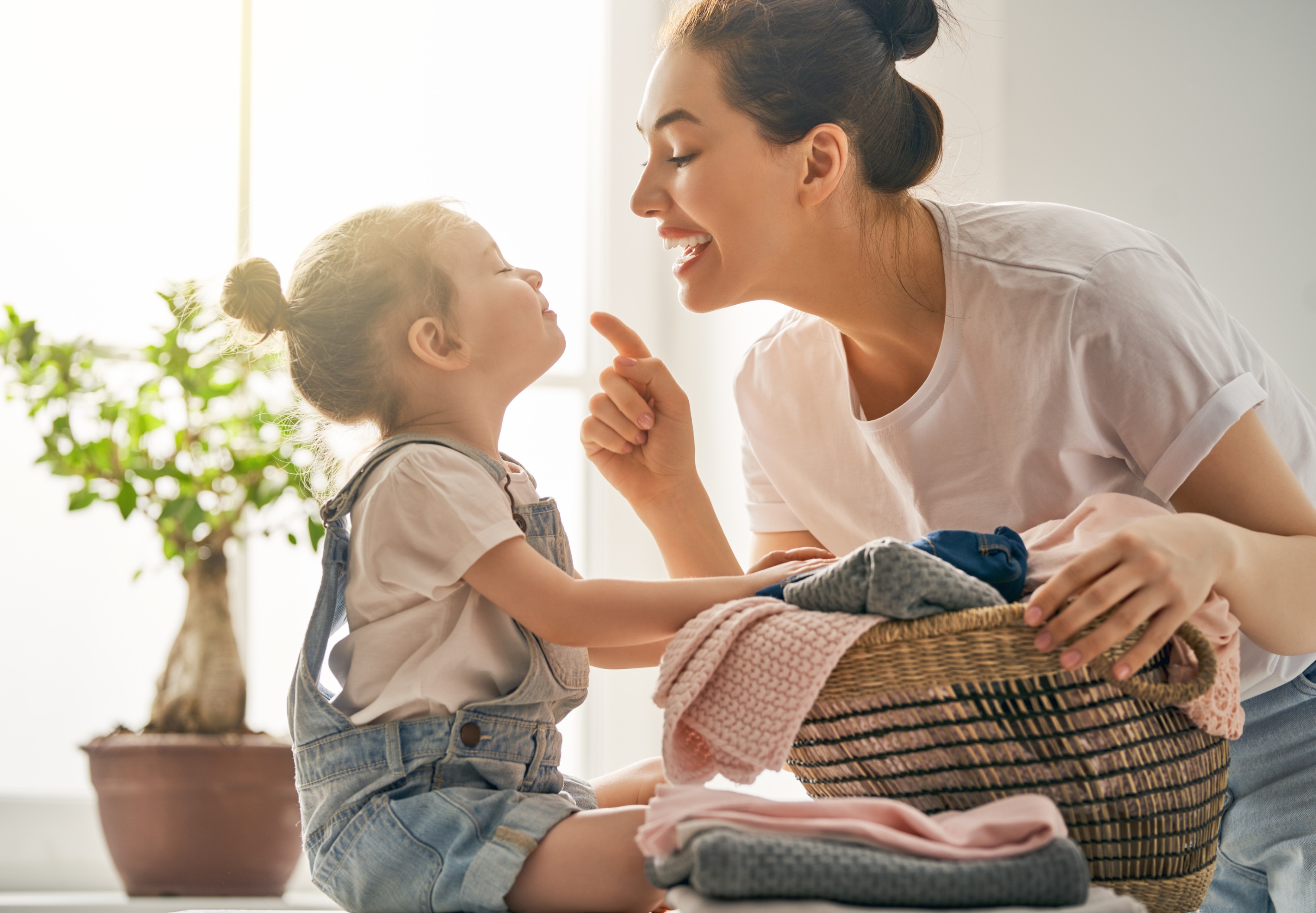 Mother and daughter sitting on the floor 