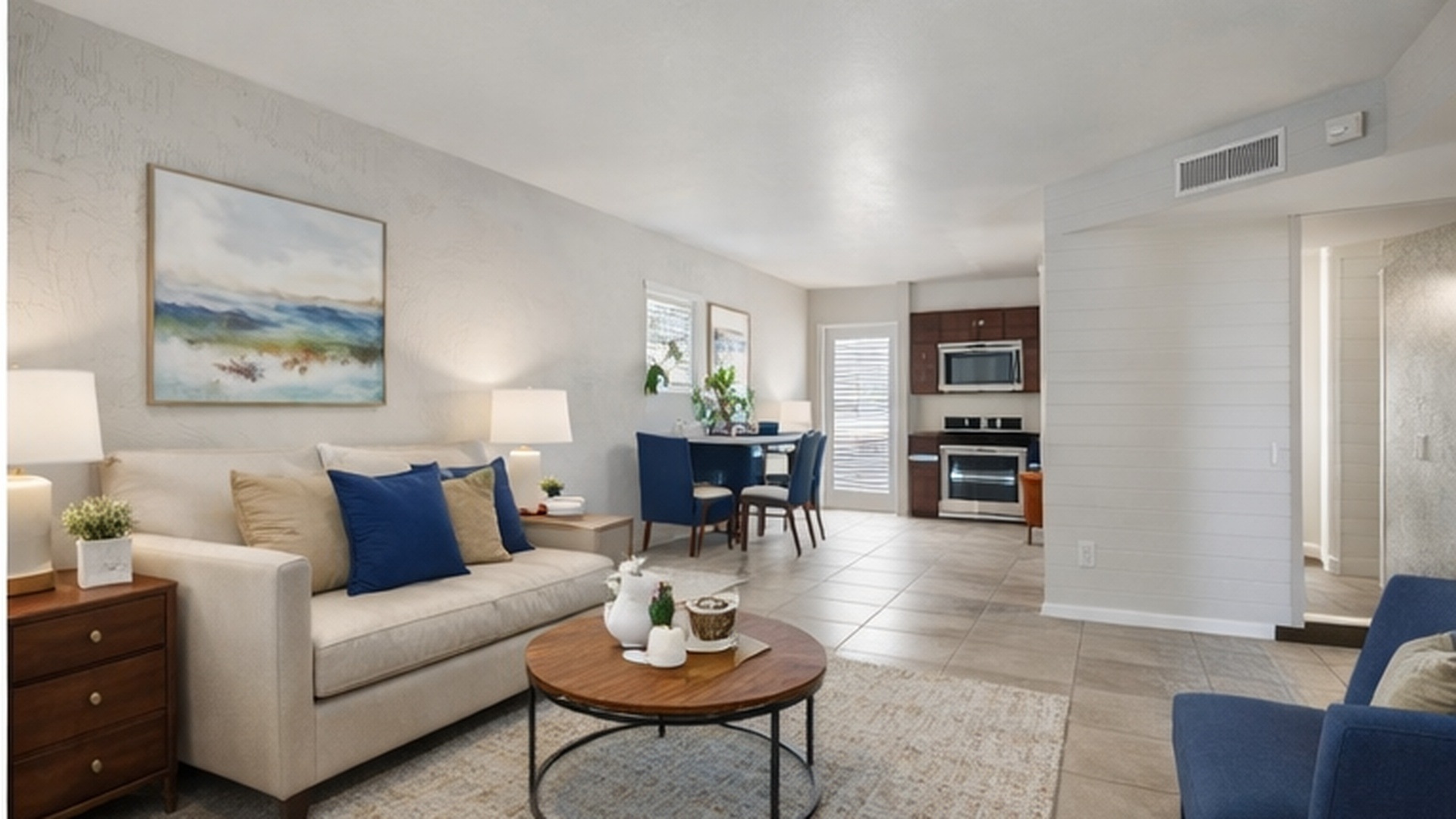 living room with tan couch, chair, and coffee table 
