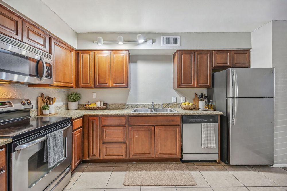 Kitchen with brown cabinets and appliances