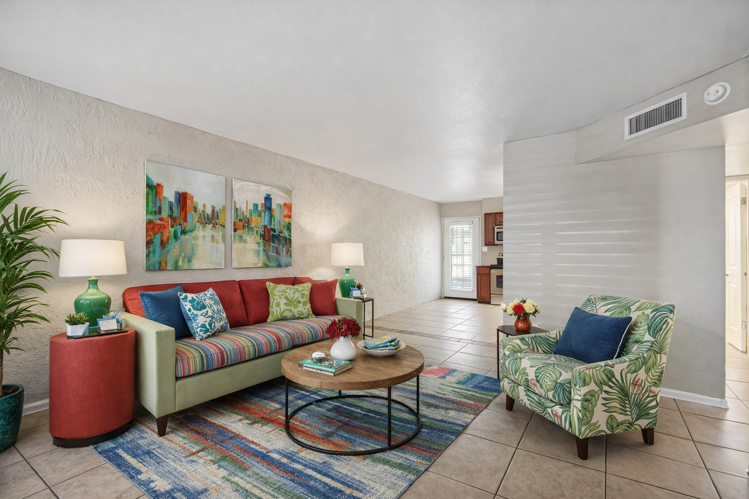 living room with couch, chairs, front entry way