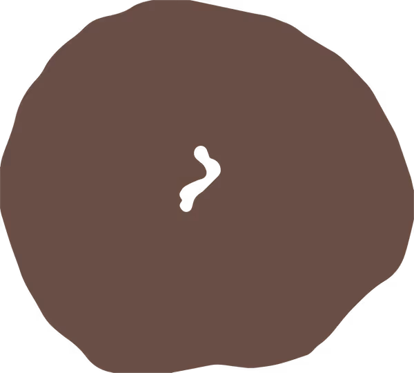 A plain bagel split into two halves placed on a white surface.