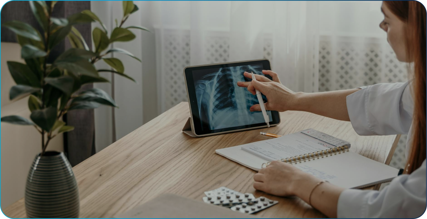 Grayscale close-up of hands typing on a backlit computer keyboard.