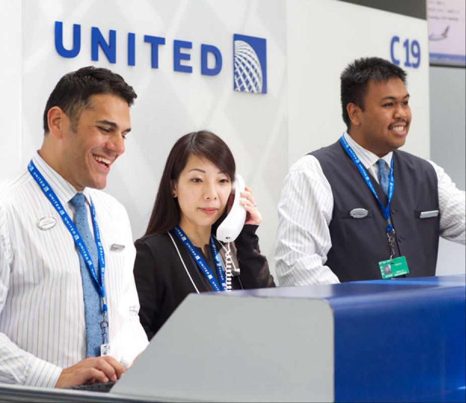 United Airline employees at the baggage claim area