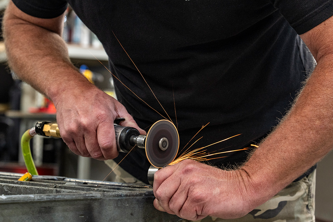 Riley employee welding