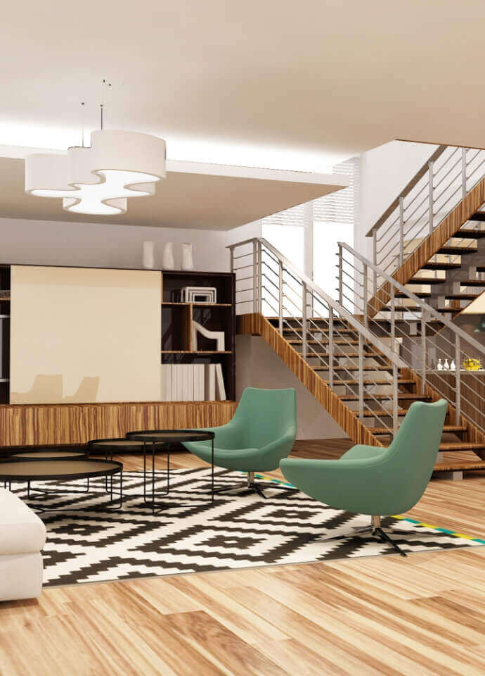 Modern living space featuring a sleek staircase, patterned rug, green accent chairs, and minimalist wooden furniture.