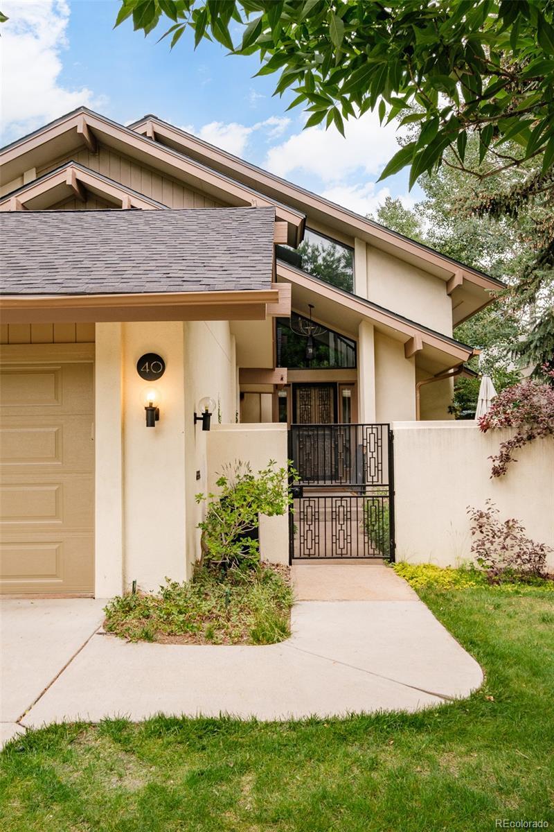 Front exterior of a remodeled Hilltop Denver home showcasing updated architecture, warm lighting, and new finishes.