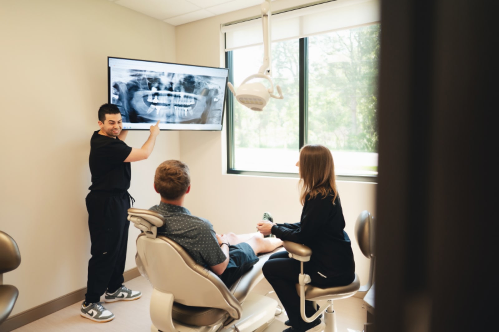 Dentists at Springfield Gentle Dental showing patient x-ray.