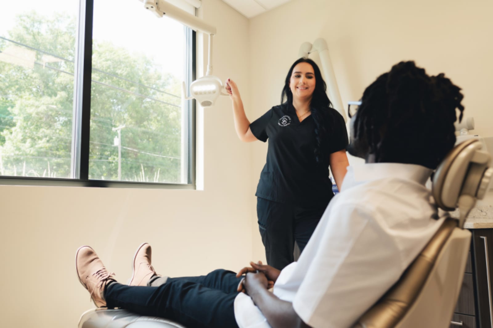 Dentist at Springfield Gentle Dental wth patient in treatment room.
