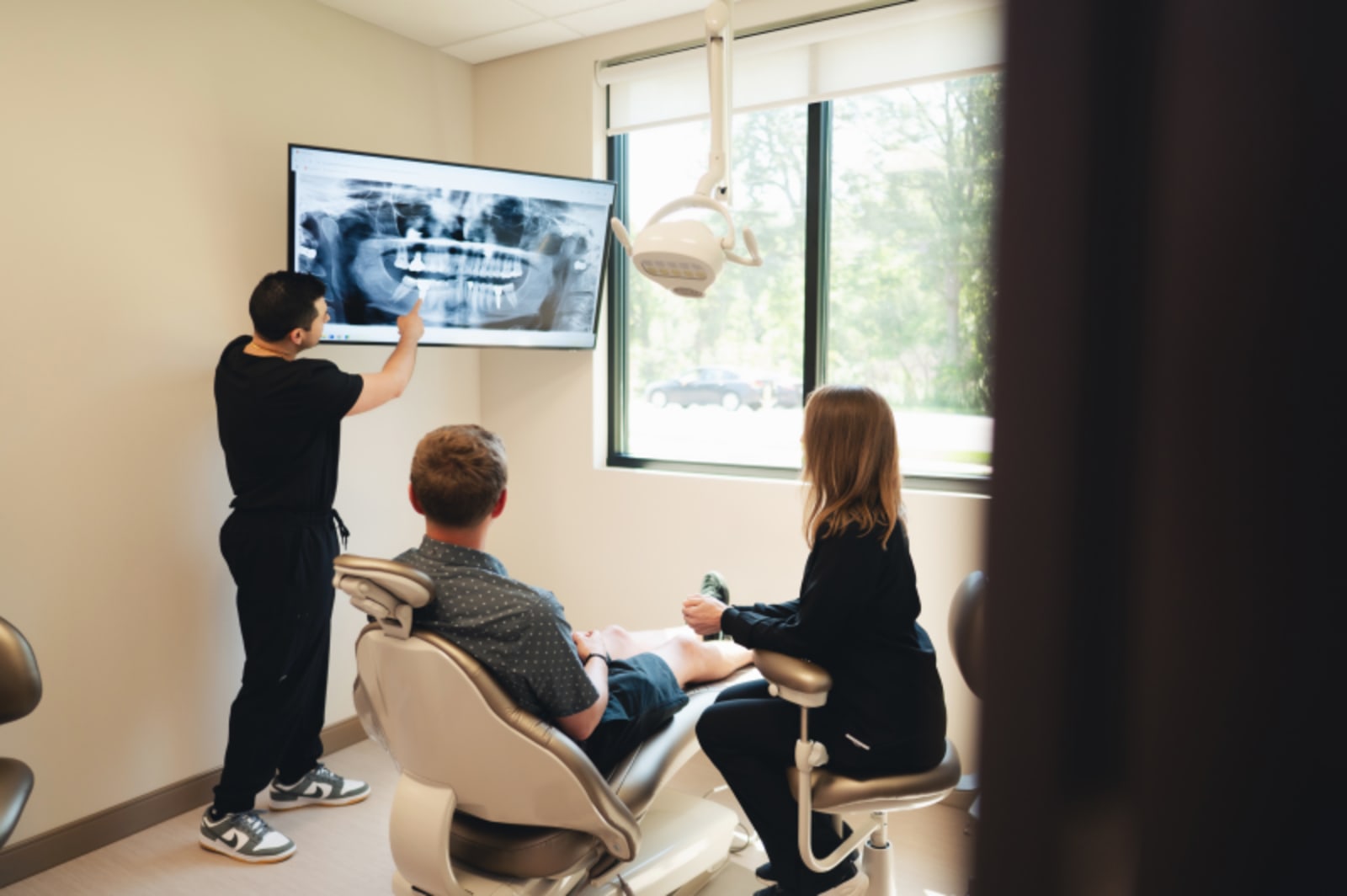 Dentist explaining treatment options to patient in consultation