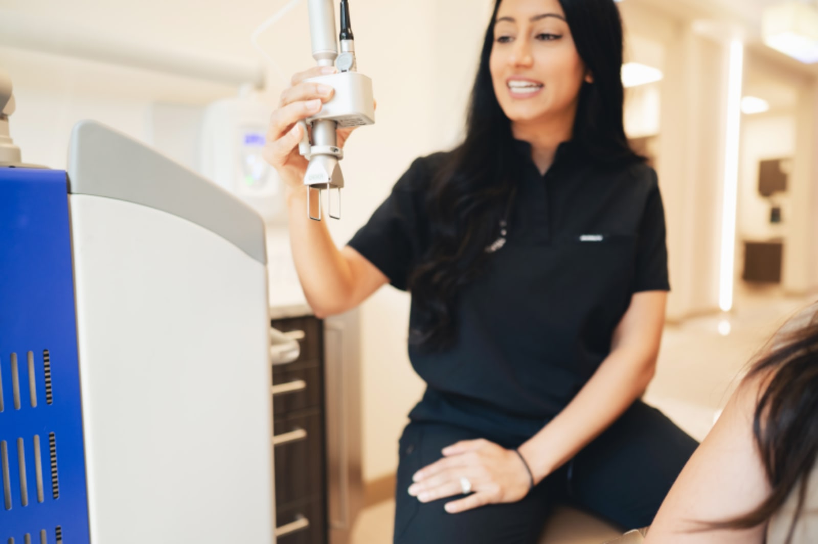 Dentist explaining oral appliance device to patient during consultation