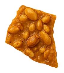 Piece of peanut brittle candy with whole peanuts embedded in golden caramel.