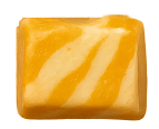 Rectangular caramel candy with white swirled stripes on top.