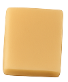 Square piece of light brown fudge with smooth texture on a white background.
