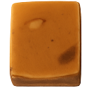 Square piece of chocolate fudge with visible nuts and a smooth texture.