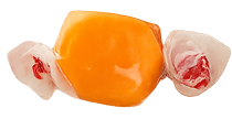 Orange taffy candy wrapped in translucent white and red wrappers on both ends.