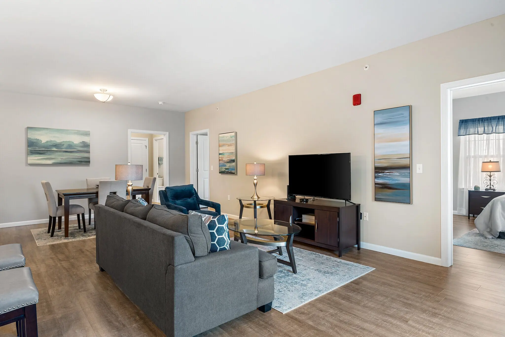 Spacious living room in the Covered Bridge apartments, Newtown, CT, with natural light and comfortable furnishings