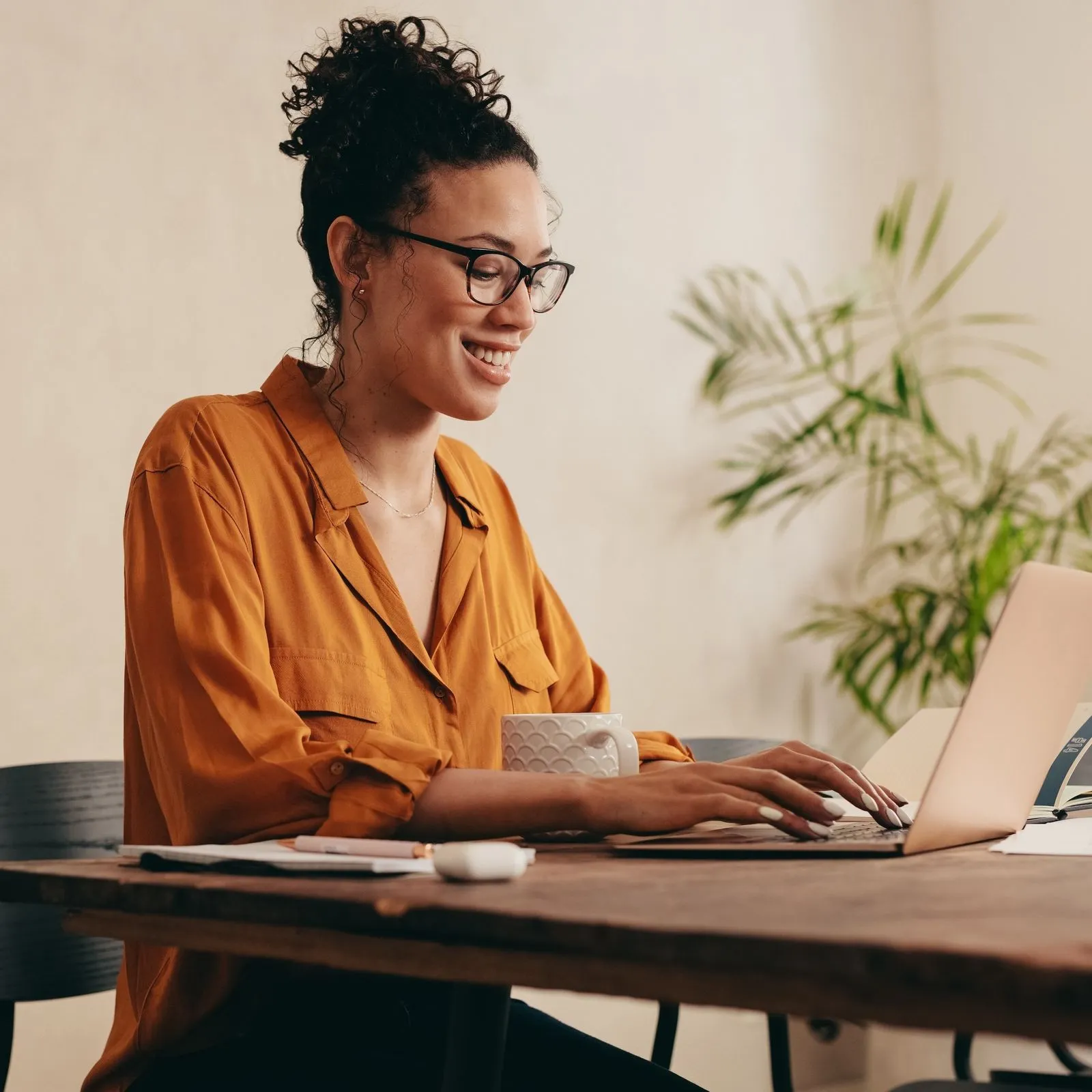 Woman typing on computer stock image