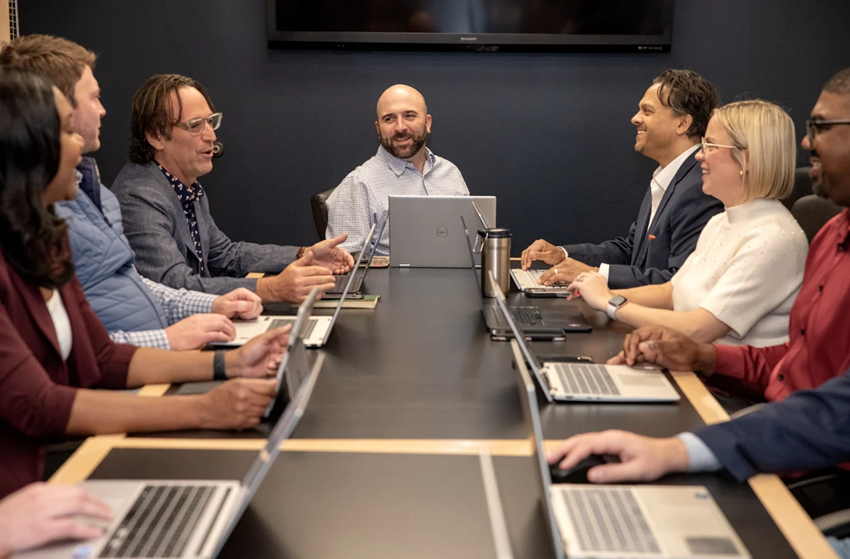 A zoomed in shot of BCS search experienced recruiters at a conference table