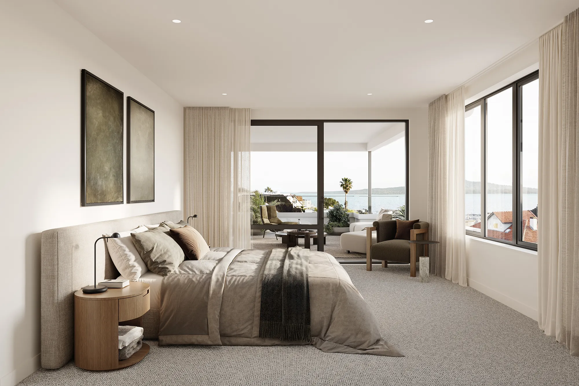 Bedroom with beige bedding, two framed artworks, a round wooden nightstand, and sliding glass doors leading to a balcony with sea view.