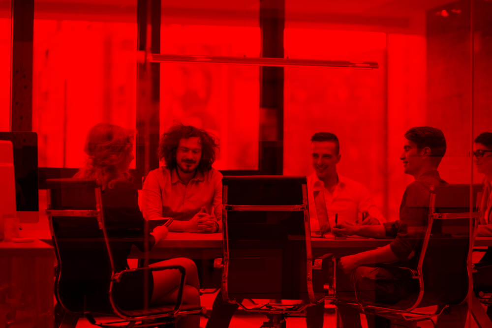 A team discussing a business plan together in an office
