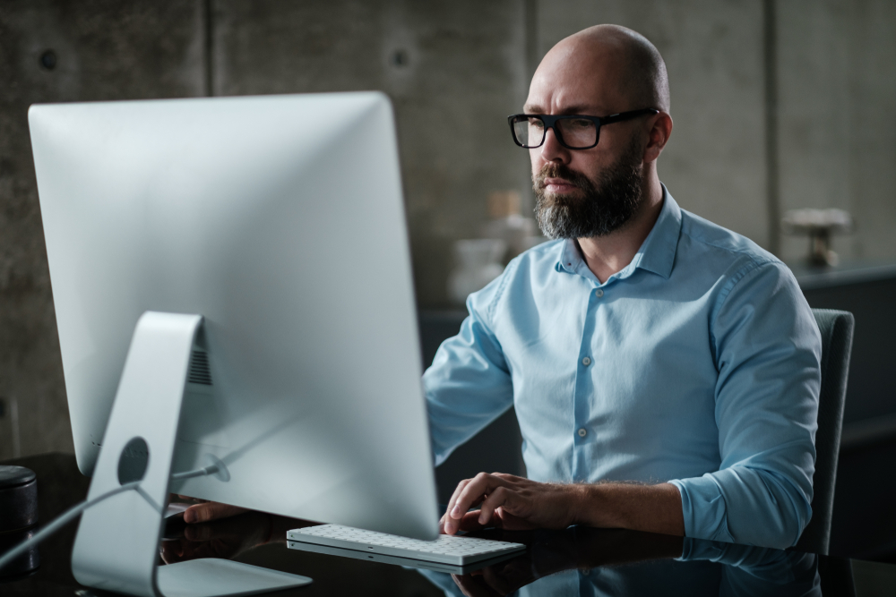 An operations manager working at a desk