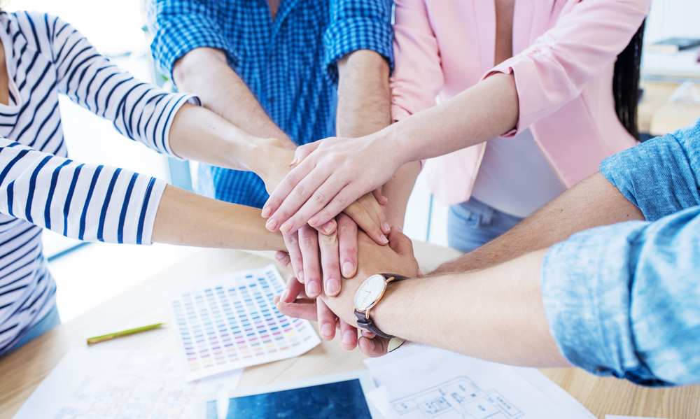 A leadership team collaborating in an office, aligned on how to execute strategy