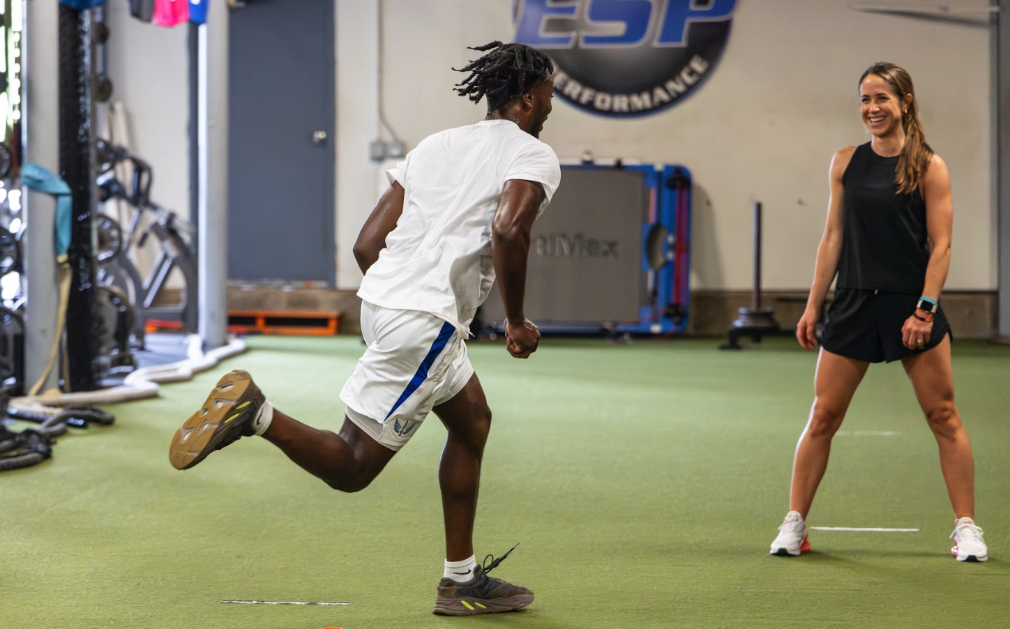 Physical therapist reviewing a runner's gait analysis at Grit Physical Therapy and Performance in Richmond, VA