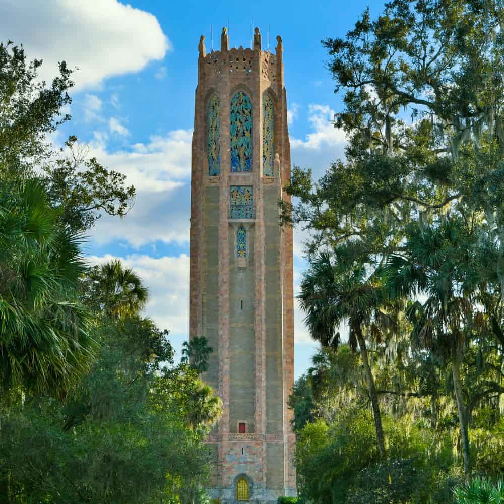 Bok Tower Gardens carillon tower framed by oak trees and Spanish moss