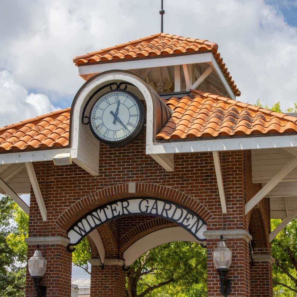 Winter Garden clock tower with a brick archway and terracotta roof