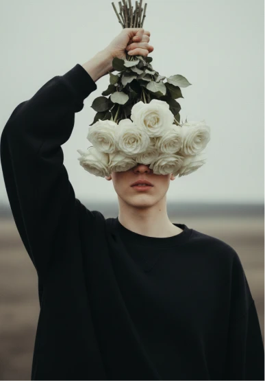 A woman with a bunch of flowers on her head.
