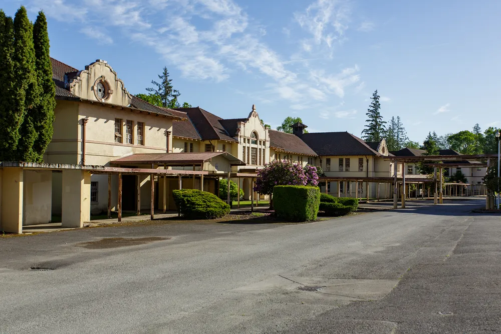 adaptive reuse projects swift center historic buildings with greenery flowers and blue sky with wispy clouds
