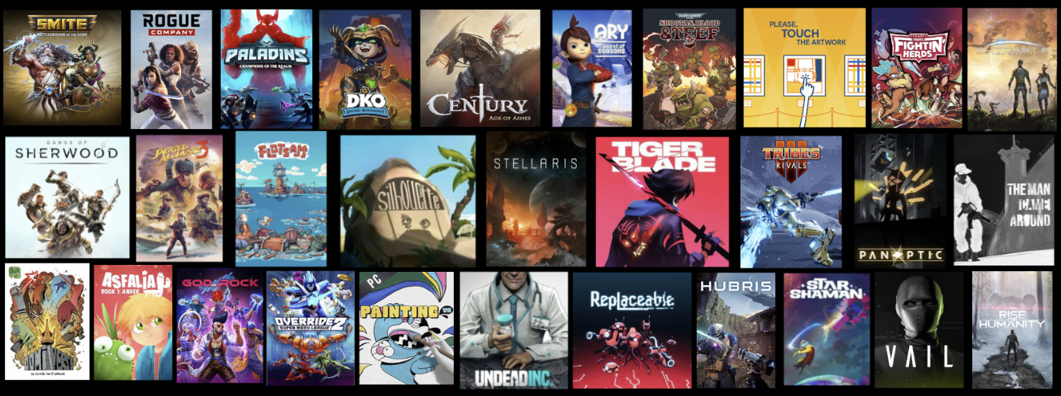 Grid of 26 colorful video game covers including Smite, Rogue Company, Paladins, DKO, Century Age of Ashes, Ary Secret of Seasons, Shootas Blood & Beef, Them's Fightin Herds, Last Oasis, Gangs of Sherwood, Jagged Alliance 3, Flotsam, Silhouette, Stellaris, Tiger Blade, Tribes Rivals, Panoptic, The Man Came Around, Do Not Feed the Monkeys, Asfalia Book 1, God of Rock, Override 2, PC Painting, Undead Inc, Replaceable, Hubris, Star Shaman, Vail, and Rise of Humanity.