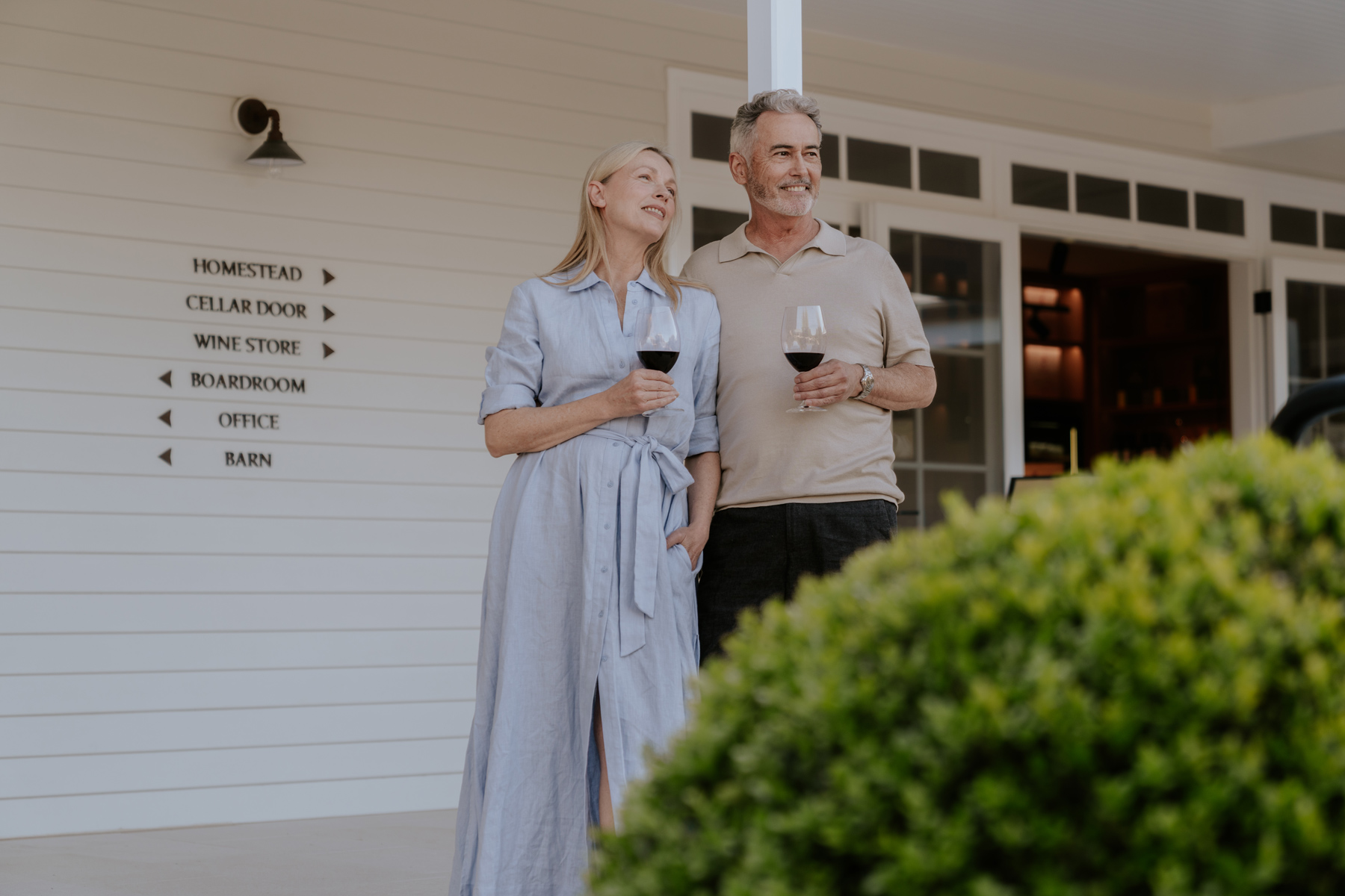 happy couple looking at view of winery