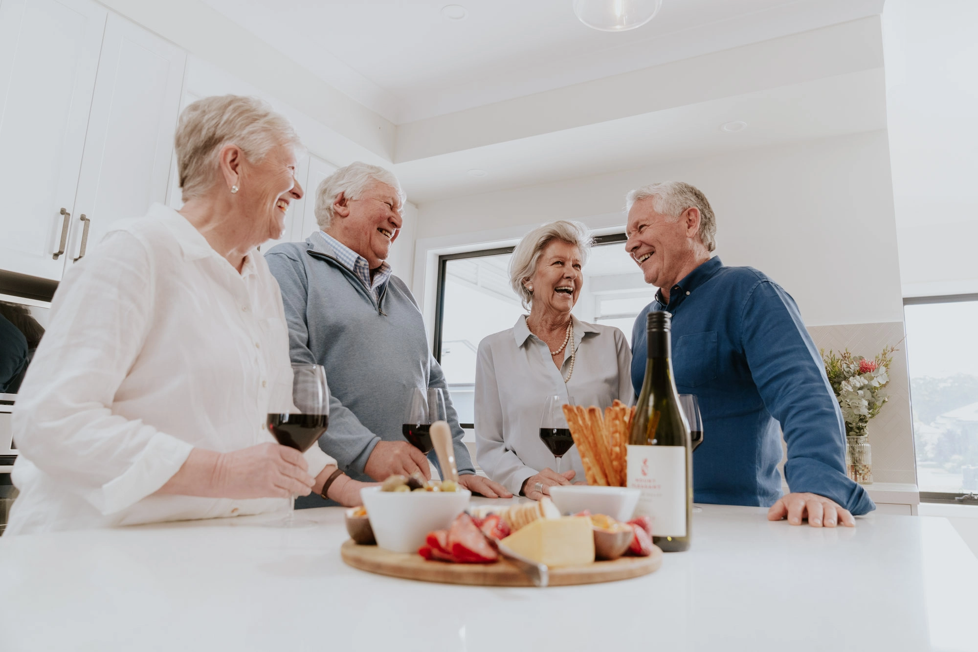 Older Friends enjoying a drink together