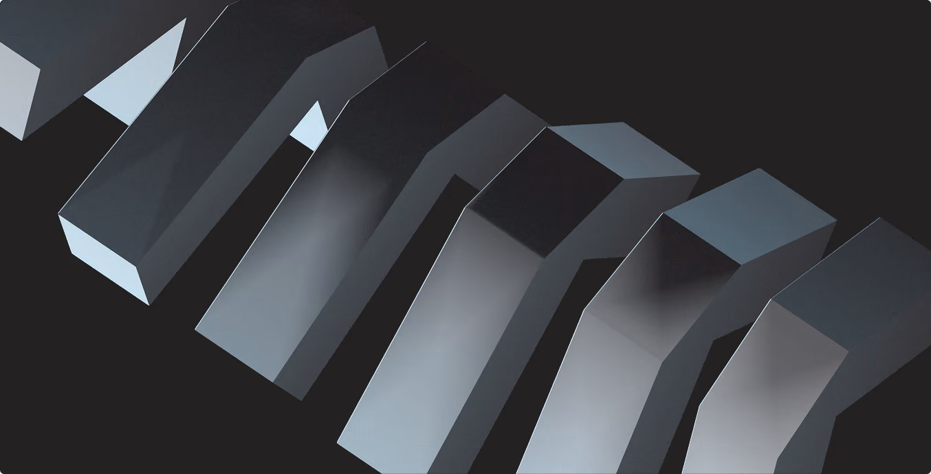 Abstract geometric shapes resembling 3D metallic arrows on a dark background.