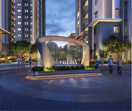 Modern residential complex entrance with illuminated curved sculpture and people walking nearby at dusk.