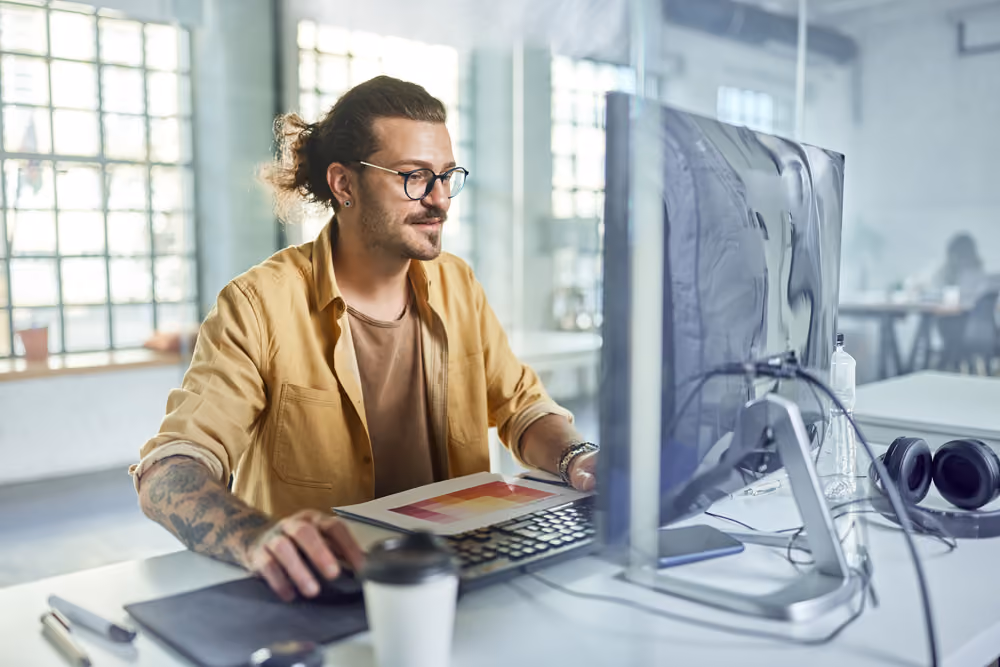 Team member working in front of the desktop