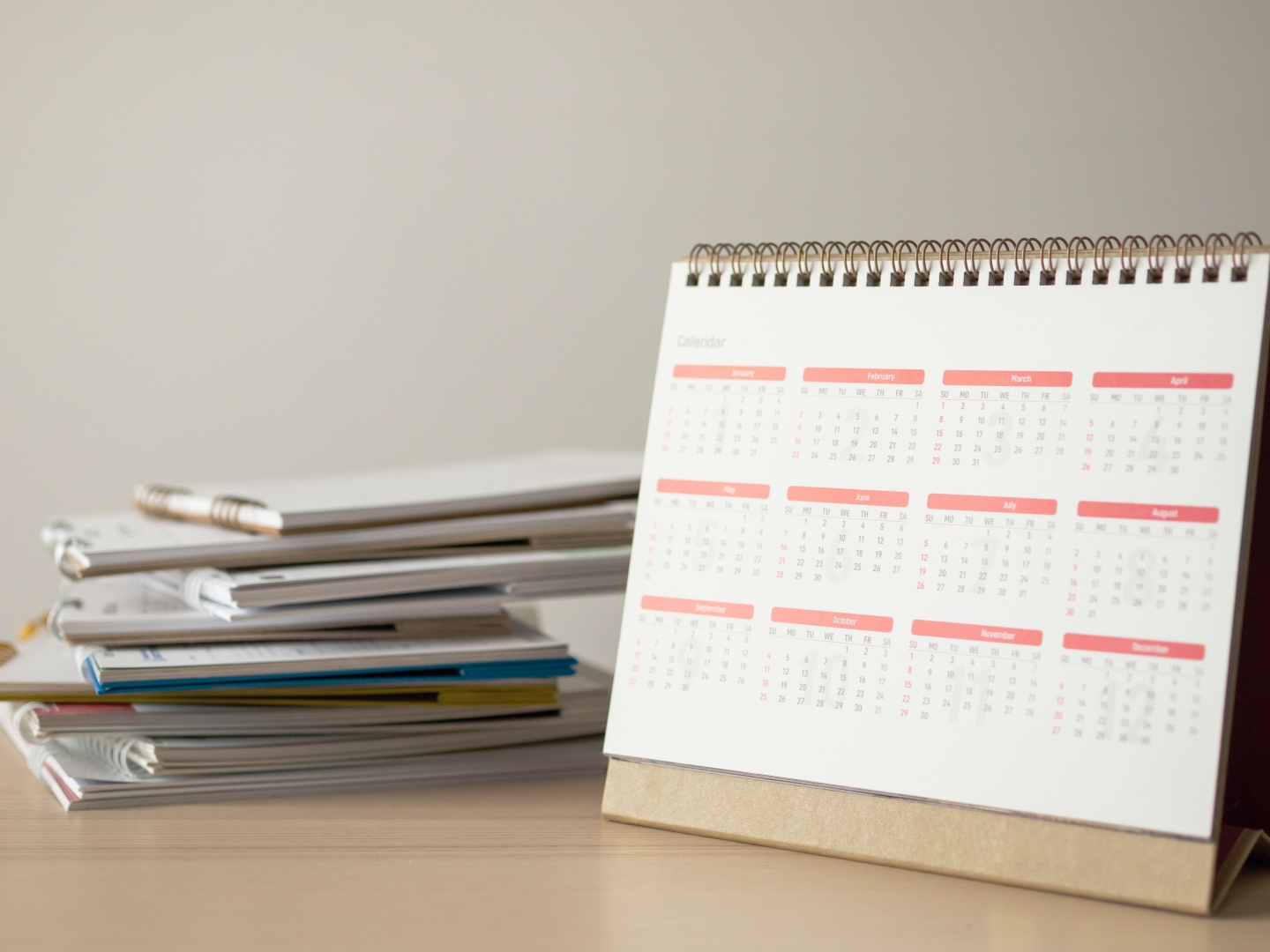 Annual compliance calendar on an organized desk at an adult day center