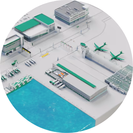 Aerial view of a modern airport terminal with two green airplanes parked near the control tower and cargo loading area beside a water body.