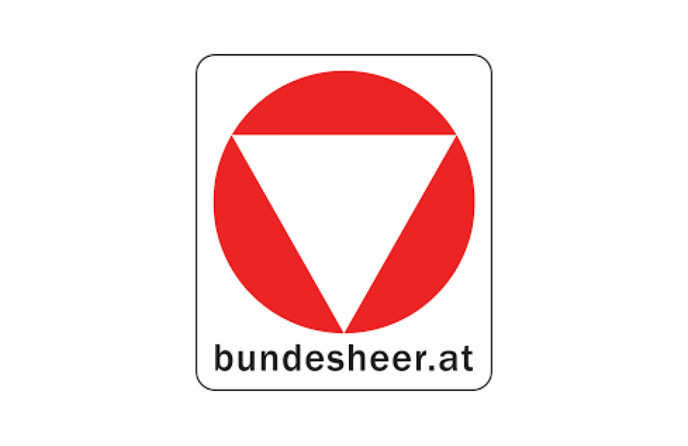 Rotes Dreieck umgekehrt in einem roten Kreis mit der schwarzen Schrift bundesheer.at darunter.