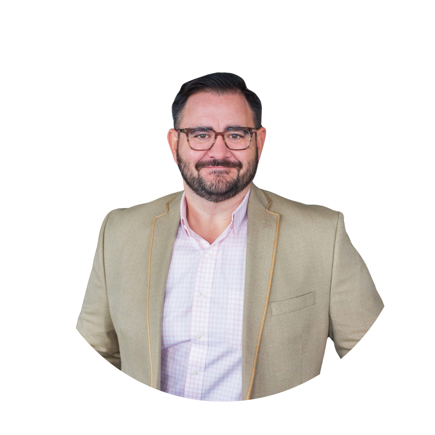 Smiling man with glasses, beard, wearing a beige blazer over a pink checkered shirt.