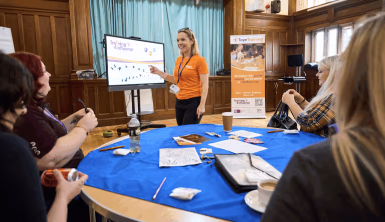 Arlo customer Tammy Banks of Taye Training delivering a training session.