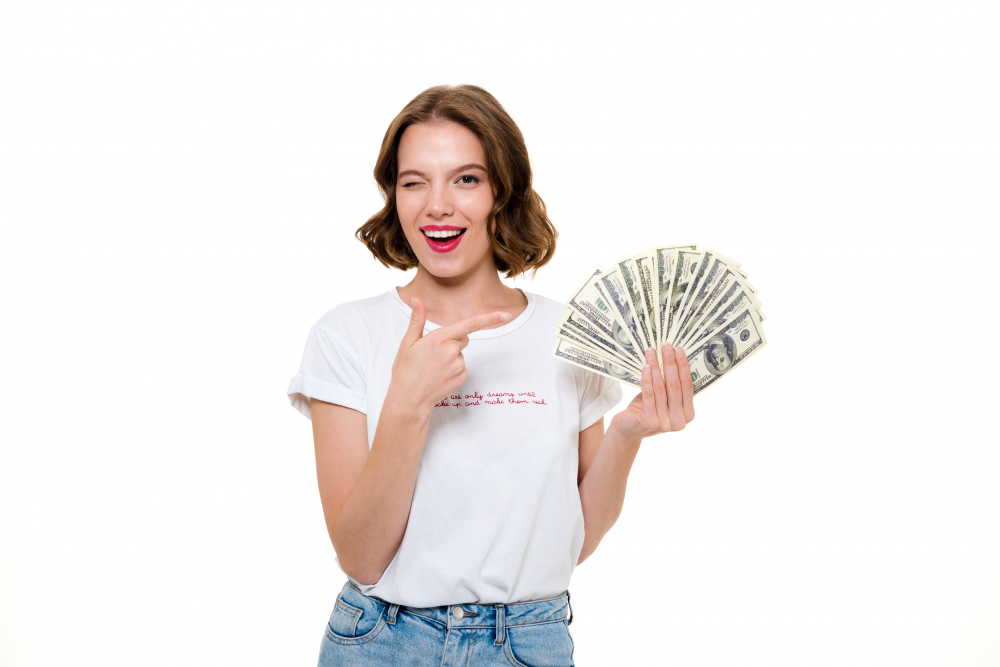 woman holding dollar bills - How to Make Money Online Trading