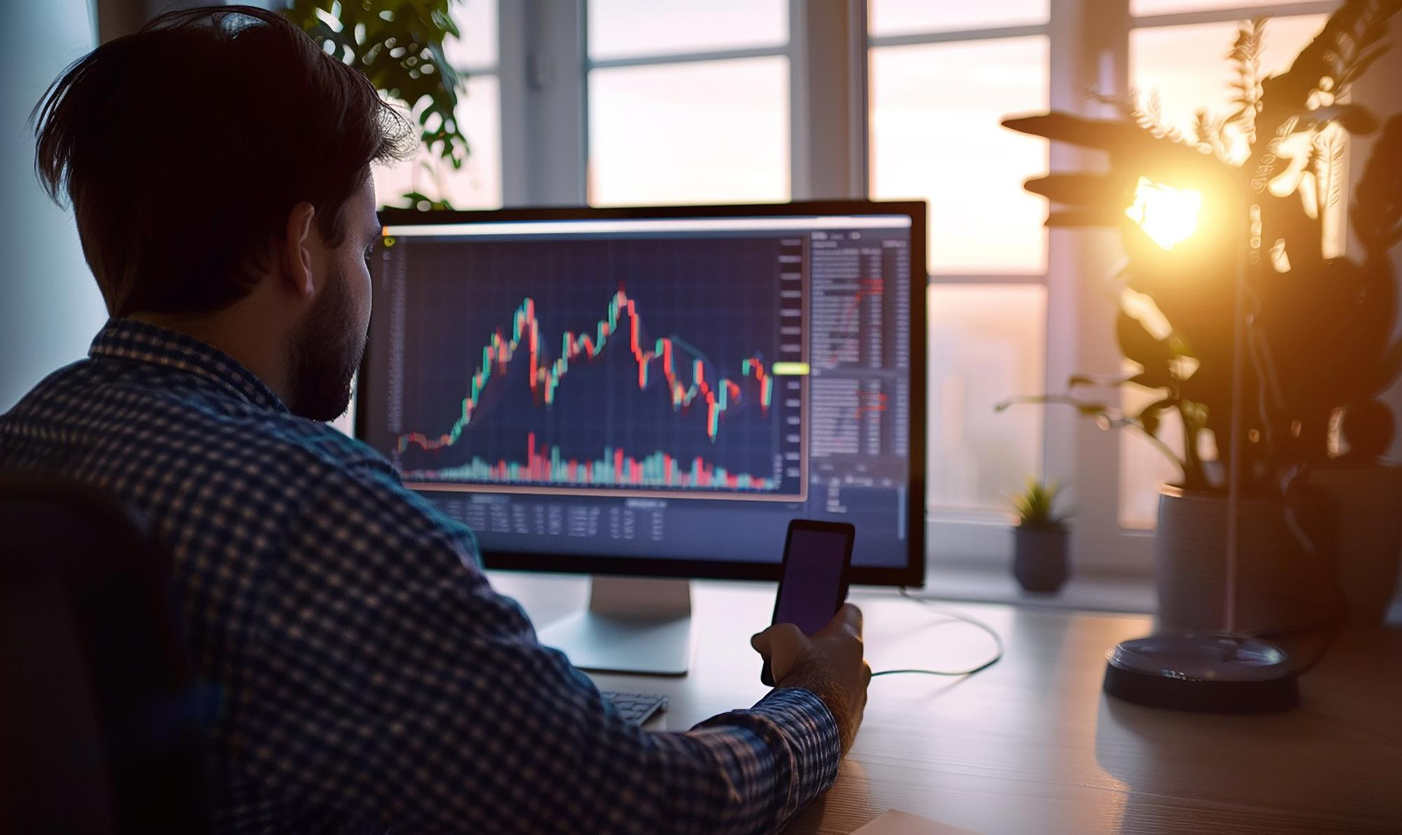 a man sitting and trading - 6 Best Markets For Day Trading for Beginners